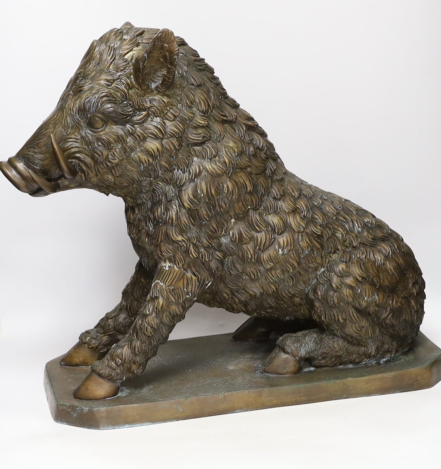 A large bronze model of a boar after Antonio Canova, 46cm high